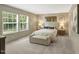 Bedroom featuring comfortable furniture and bright, sunlit windows offering a relaxing space at 150 Will Woods Way, Franklinton, NC 27525
