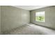 Carpeted bedroom with large window that provides plenty of natural light at 150 Will Woods Way, Franklinton, NC 27525