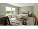 A comfortable bedroom with two bright windows shows natural light and a cozy space at 150 Will Woods Way, Franklinton, NC 27525
