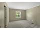 Bedroom with plush carpeting, a bright window, and ample space for relaxation at 150 Will Woods Way, Franklinton, NC 27525