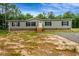 Charming single-story home with gray siding, black shutters, and a welcoming front porch at 150 Will Woods Way, Franklinton, NC 27525