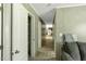 Hallway displaying a coat closet, neutral walls, and transitions to an open area at 150 Will Woods Way, Franklinton, NC 27525