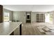 Hallway with light wood floors and a view of the front door and back deck at 150 Will Woods Way, Franklinton, NC 27525