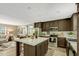 Kitchen featuring an island with breakfast bar, stainless steel appliances, and ample cabinet space at 150 Will Woods Way, Franklinton, NC 27525