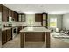 Modern kitchen with stainless steel appliances, stone countertops and a large island at 150 Will Woods Way, Franklinton, NC 27525