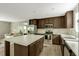 Modern kitchen with stainless steel appliances, stone countertops and a large island at 150 Will Woods Way, Franklinton, NC 27525