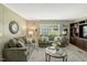 Cozy living room with comfortable seating and natural light from the window at 150 Will Woods Way, Franklinton, NC 27525