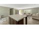 Open concept living room with neutral tones and a view of the entryway at 150 Will Woods Way, Franklinton, NC 27525