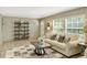 Spacious living room with bright natural light, neutral decor, and comfortable furnishings at 150 Will Woods Way, Franklinton, NC 27525