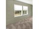 Two bright windows let natural light into this calm, gray-toned bedroom at 150 Will Woods Way, Franklinton, NC 27525