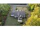 Overhead aerial view of a stylish home, landscaped yard, and long driveway at 15517 Possum Track Rd, Raleigh, NC 27614