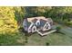 Aerial view of the home displaying its lush landscaping, expansive lawn, and large lot with mature trees at 15517 Possum Track Rd, Raleigh, NC 27614