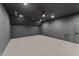 Finished basement with neutral carpet, dark trim, and recessed lighting at 15517 Possum Track Rd, Raleigh, NC 27614