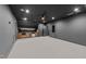 Finished basement featuring a wet bar with wooden cabinets and plenty of counter space at 15517 Possum Track Rd, Raleigh, NC 27614