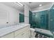 Modern bathroom with a glass-enclosed shower, a marble vanity, and contemporary fixtures at 15517 Possum Track Rd, Raleigh, NC 27614