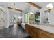 Luxurious bathroom with a soaking tub, walk-in shower, and double vanity with a large mirror at 15517 Possum Track Rd, Raleigh, NC 27614