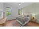 Cozy bedroom with natural light, stylish decor, and hardwood floors at 15517 Possum Track Rd, Raleigh, NC 27614