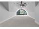 Large bonus room with dormer windows and a built in window seat flanked by cabinets at 15517 Possum Track Rd, Raleigh, NC 27614