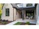 Inviting front porch with stone and wood accents and comfortable seating at 15517 Possum Track Rd, Raleigh, NC 27614