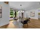 Cozy sitting area with large windows, stylish decor, and hardwood floors at 15517 Possum Track Rd, Raleigh, NC 27614