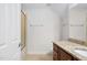 Bathroom featuring vanity with granite countertops and a tub with glass door at 1604 Vineyard Mist Dr, Cary, NC 27519