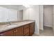 Bathroom features a double sink vanity with granite countertops at 1604 Vineyard Mist Dr, Cary, NC 27519