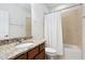 Bathroom featuring vanity with granite countertops and a tub with shower at 1604 Vineyard Mist Dr, Cary, NC 27519