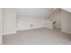Upstairs bonus room with neutral carpet and access to storage at 1604 Vineyard Mist Dr, Cary, NC 27519