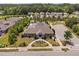 An aerial view of the community clubhouse showcases manicured landscaping and ample parking spaces at 1604 Vineyard Mist Dr, Cary, NC 27519