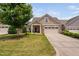 Charming single-Gathering home featuring a well-manicured lawn and an attached two-car garage at 1604 Vineyard Mist Dr, Cary, NC 27519
