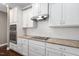 Gourmet kitchen showcases stainless steel appliances, granite countertops, and custom white cabinetry at 1604 Vineyard Mist Dr, Cary, NC 27519