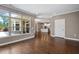 The spacious living room features wood floors and large windows, bathing the room in natural light at 1604 Vineyard Mist Dr, Cary, NC 27519