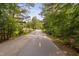 Community walking path through a natural wooded area at 1604 Vineyard Mist Dr, Cary, NC 27519