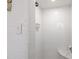 Bright white tiled shower with marble shelf offers a clean, modern aesthetic at 1700 St Marys St, Raleigh, NC 27608