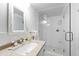 Charming bathroom with granite vanity, framed mirror, and glass-enclosed shower at 1700 St Marys St, Raleigh, NC 27608