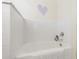 Clean, well-lit bathtub with white subway tile and neutral decor create a soothing atmosphere at 1700 St Marys St, Raleigh, NC 27608