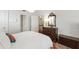 Comfortable bedroom featuring a decorative chest, antique mirror and ample natural light at 1700 St Marys St, Raleigh, NC 27608