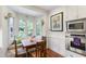 This eat-in breakfast nook features a bay window and stainless oven and microwave at 1700 St Marys St, Raleigh, NC 27608