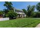 Classic home with a well-manicured lawn and a charming white picket fence at 1700 St Marys St, Raleigh, NC 27608