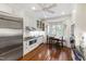 Bright kitchen features stainless appliances, white cabinets, hardwood floors, and breakfast nook at 1700 St Marys St, Raleigh, NC 27608