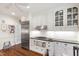 Bright kitchen features stainless appliances, white cabinets, granite countertops, and hardwood floors at 1700 St Marys St, Raleigh, NC 27608