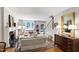 Living room with a fireplace, hardwood floors, and ample natural light at 1700 St Marys St, Raleigh, NC 27608