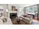 Bright living room with a fireplace, hardwood floors, and comfortable seating at 1700 St Marys St, Raleigh, NC 27608