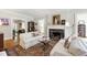 Bright living room with a fireplace, hardwood floors, and neutral color palette at 1700 St Marys St, Raleigh, NC 27608