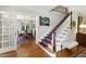 Staircase with a runner, wooden banister, and natural light at 1700 St Marys St, Raleigh, NC 27608