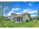 Inviting backyard featuring a screened porch, patio, and well-maintained lawn, perfect for outdoor enjoyment at 1808 Pennypacker Ln, Durham, NC 27703