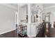 Open-concept bar with pendant lighting, barstools, and a beverage cart for entertaining guests at 1808 Pennypacker Ln, Durham, NC 27703