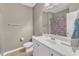 Bathroom featuring a white vanity, toilet, and a shower with a colorful patterned curtain at 1808 Pennypacker Ln, Durham, NC 27703