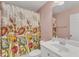 Bathroom featuring a vanity, toilet, mirror, and a shower with floral curtain at 1808 Pennypacker Ln, Durham, NC 27703