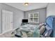Bedroom showcasing a blue bed frame and an entertainment unit at 1808 Pennypacker Ln, Durham, NC 27703